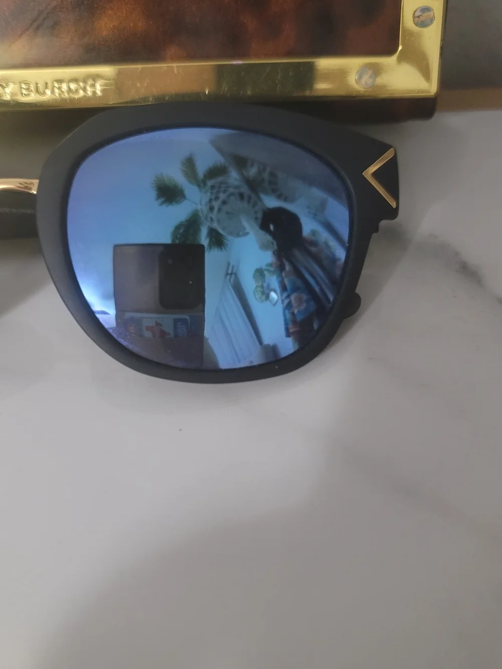 Tory Burch Black Frame Sunglasses with Blue Mirrored Lenses